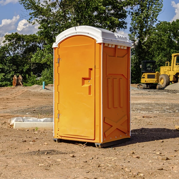 what is the cost difference between standard and deluxe portable restroom rentals in Bynum